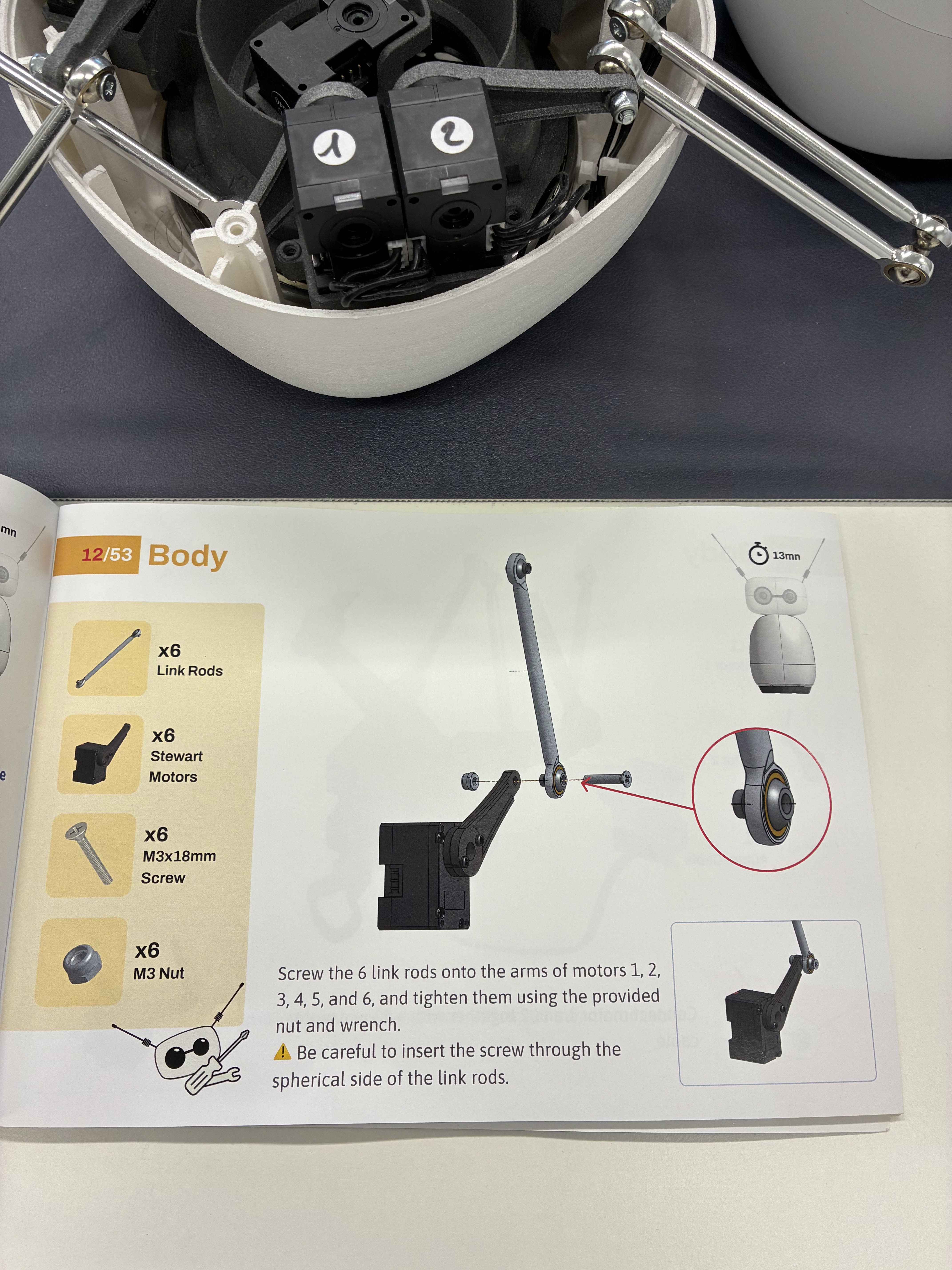 Assembly guide open next to reachy